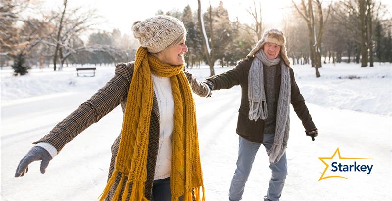 Image of a senior man and woman ice skating in a park